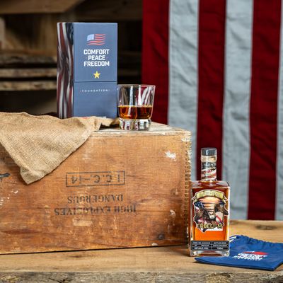 Gift box and bottle on vintage crate